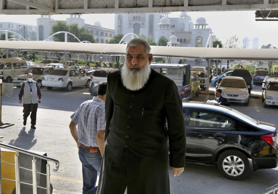 Rai Bashir, a defense lawyer for one of the suspects in Daniel Pearl murder case, arrives at the Supreme Court for an appeal hearing in the Pearl case, in Islamabad, Pakistan, Wednesday, Oct. 7, 2020. Ahmed Omar Saeed Sheikh, a British-born Pakistani who has been on death row over the 2002 killing of U.S. journalist Pearl, will remain in jail for another three months under a government order, a prosecutor told the country's top court Wednesday. (AP Photo/Anjum Naveed)