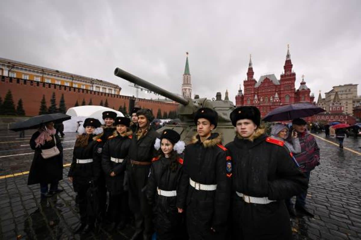 Cadets pose with an artist wearing WWII military uniform at an open air interactive museum at The Red Square in Moscow (AFP via Getty Images)