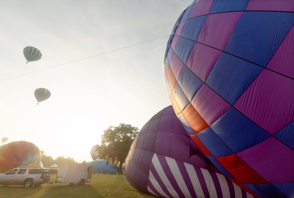 Balloons sit waiting to launch Friday morning at the Kent State University at Stark campus in Jackson Township. The balloons are participating in the 2023 Balloon Classic.