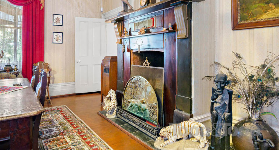 A fire place and statues are seen inside the Melory Crescent, Magill home.