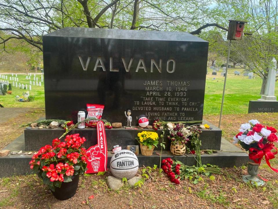 Legendary NC State basketball coach Jim Valvano is buried in Oakwood Cemetery in Raleigh, where fans are flocking to pay tribute.
