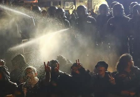 Riot police uses tear gas against people in the Schanze district following the G20 summit in Hamburg, July 9, 2017. REUTERS/Kai Pfaffenbach