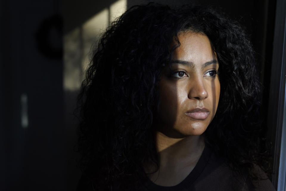 Pariss Chandler, of Randolph, Mass., founder of the recruitment platform website Black Tech Pipeline, sits for a photograph at her home, Thursday, Nov. 3, 2022, in Randolph. Chandler built a community for Black tech workers on Twitter that eventually became the foundation for her own recruitment company. (AP Photo/Steven Senne)