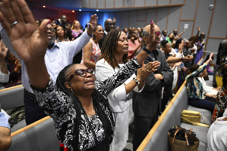 Members of the congregation at Kingdom Fellowship AME Church raise their hands in praise during church service, Sunday, June 2, 2024, in Calverton, Md. The suburban Maryland congregation, led by the Rev. Matthew L. Watley, has landed at the top of a list of the fastest-growing churches in America. (AP Photo/Terrance Williams)