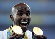 2016 Rio Olympics - Athletics - Victory Ceremony - Men's 5000m Victory Ceremony - Olympic Stadium - Rio de Janeiro, Brazil - 20/08/2016. Gold medalist Mo Farah (GBR) of Britain reacts. REUTERS/Stoyan Nenov