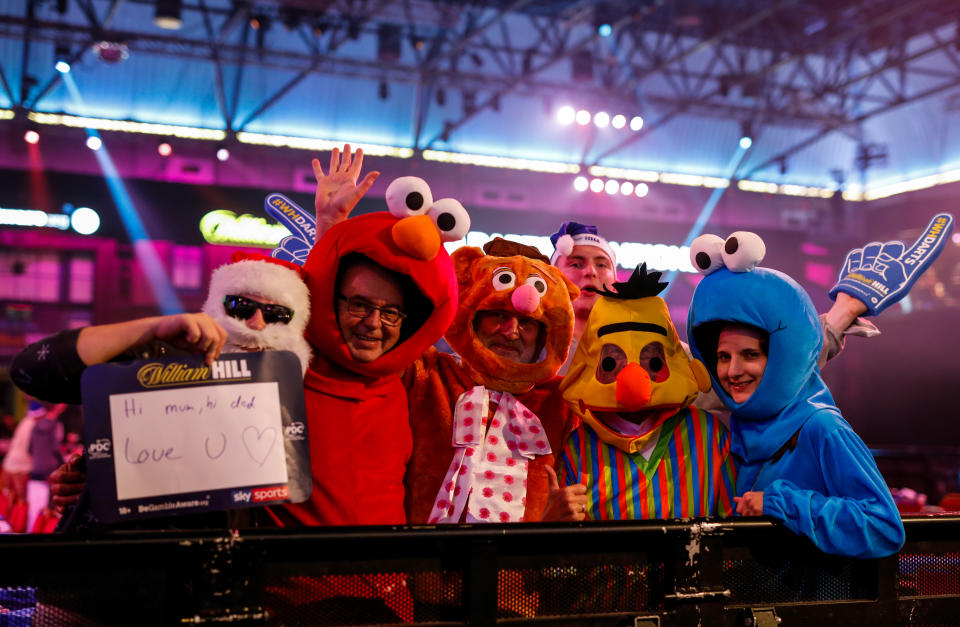 Fresh from Sesame Street, these fans made an appearance with... Santa? (Photo by Steven Paston/PA Images via Getty Images)