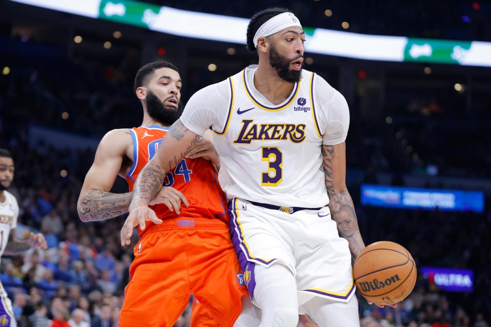 Oklahoma City Thunder forward Kenrich Williams (34) defends Los Angeles Lakers forward Anthony Davis (3) during an NBA basketball game between the Oklahoma City Thunder and the Los Angeles Lakers at Paycom Center in Oklahoma City, Saturday, Dec. 23, 2023. the Thunder lost 129-120.