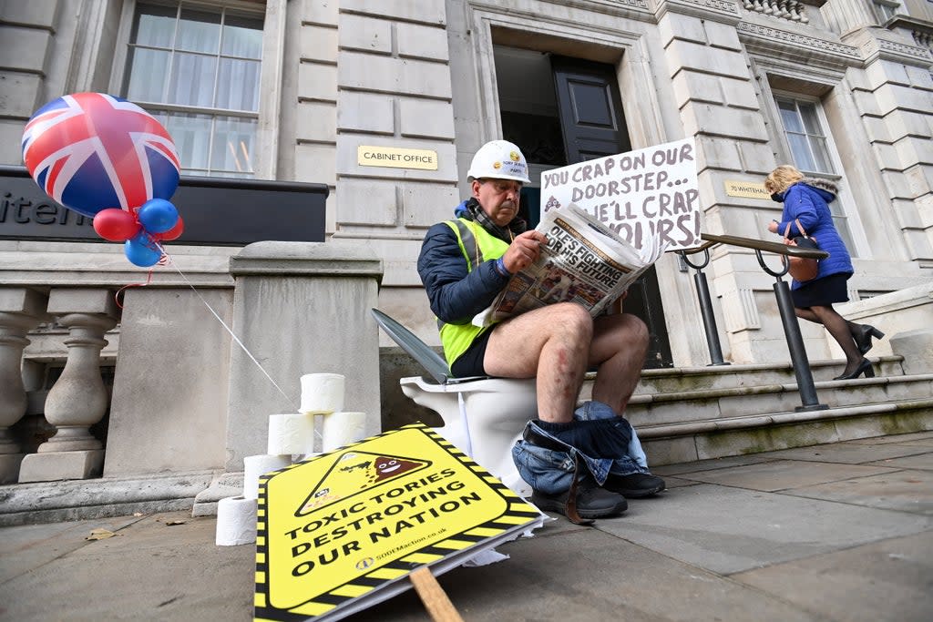 Smash the cistern: protester Steve Bray sits on a toilet outside Whitehall on Wednesday  (EPA)