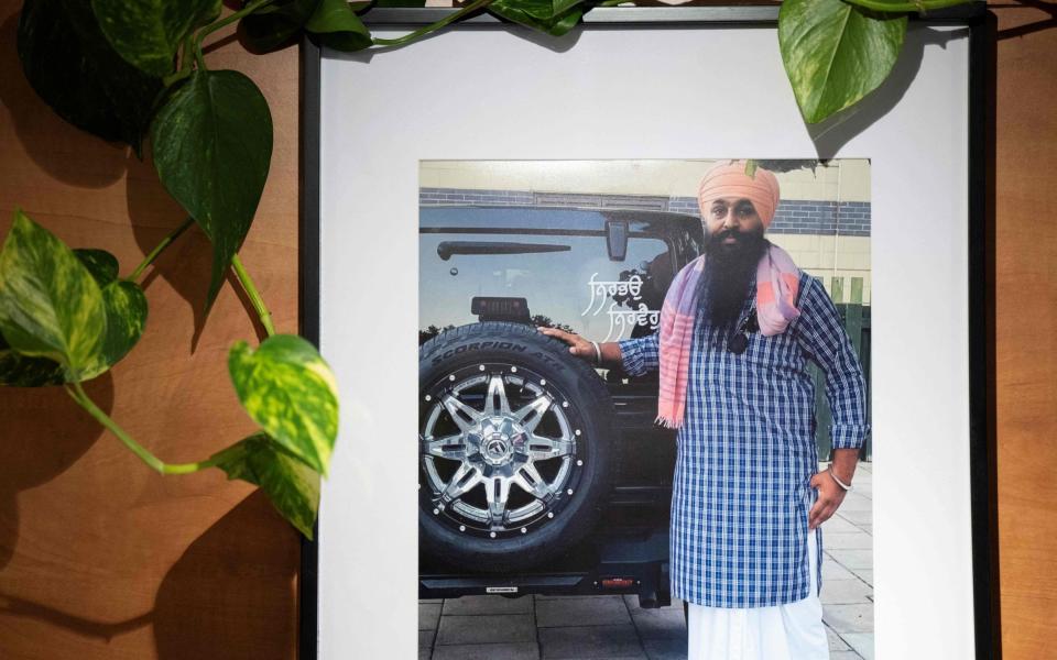 A portrait of late Sikh activist Avtar Singh Khanda is hanged on a wall in the Panjab Broadcasting Channel television station