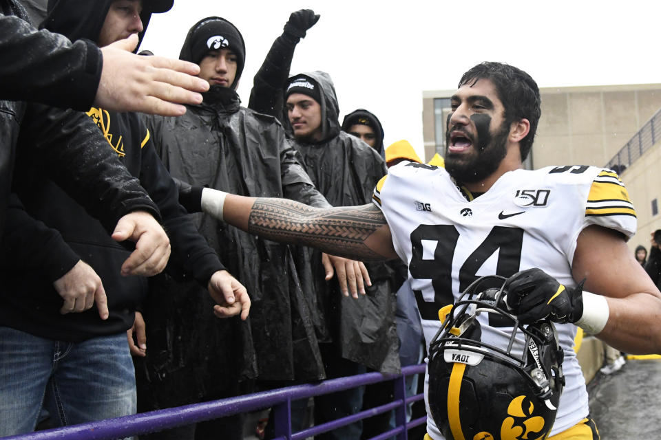 FILE - In this Oct. 26, 2019, file photo, Iowa defensive end A.J. Epenesa (94) celebrates his teams 20-0 win against Northwestern in an NCAA college football game in Evanston, Ill. Epenesa was selected to The Associated Press All-Big Ten Conference team, Wednesday, Dec. 11, 2019. (AP Photo/David Banks, File)