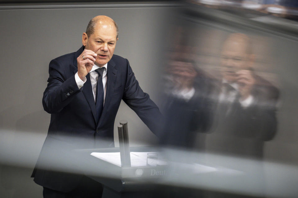 German Chancellor Olaf Scholz delivers his speach during a session of the German parliament Bundestag at the Reichstag building in Berlin, Germany, Wednesday, June 1, 2022.( Michael Kappeler/dpa via AP)