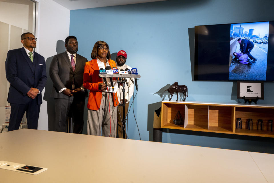 Celena Morrison-McLean reads a statement, standing with Darius McLean, right, and their attorneys Riley Ross, left, and Kevin Mincey, second from left, during a news conference on Thursday, March 7, 2024 in Philadelphia. Celena Morrison-McLean, a Philadelphia city official was arrested over the weekend during a traffic stop and started recording the incident because she feared for her husband's life as a trooper handcuffed him on a rainy elevated highway. (Tom Gralish/The Philadelphia Inquirer via AP)