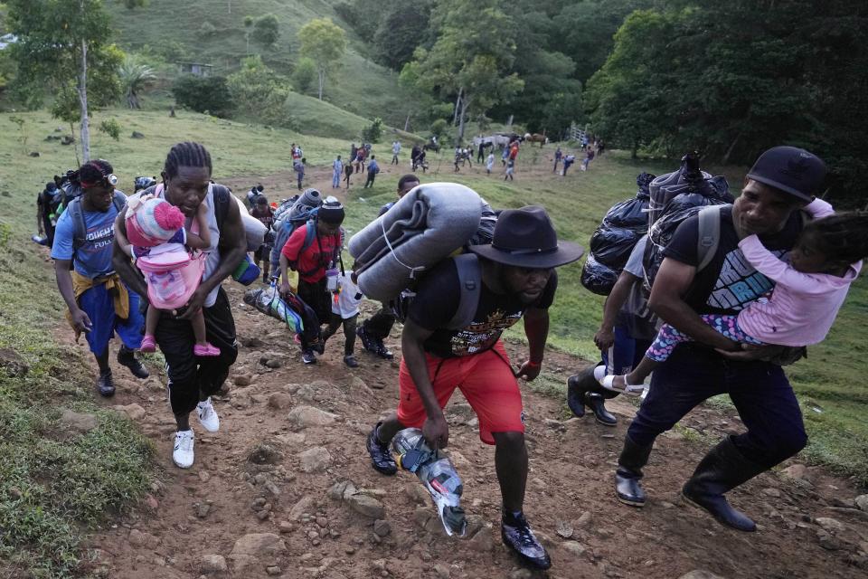 Migrants continue on their trek north, near Acandi, Colombia, Wednesday, Sept. 15, 2021. The migrants, mostly Haitians, are on their way to crossing the Darien Gap from Colombia into Panama dreaming of reaching the U.S. (AP Photo/Fernando Vergara)