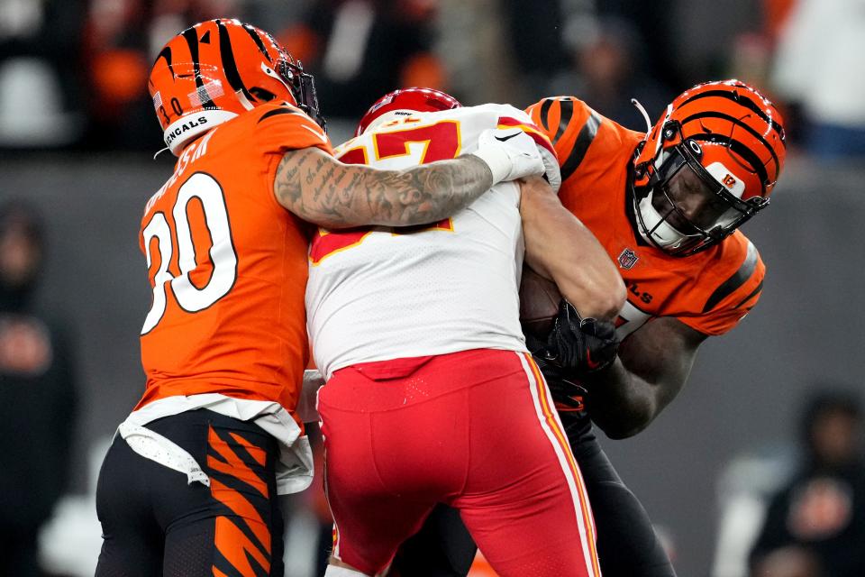 Cincinnati Bengals linebacker Germaine Pratt (57) strips the ball from Kansas City Chiefs tight end Travis Kelce (87) for a turnover in the fourth quarter of a Week 13 NFL game, Sunday, Dec. 4, 2022, at Paycor Stadium in Cincinnati. Mandatory Credit: Kareem Elgazzar-The-Cincinnati Enquirer-USA TODAY Sports