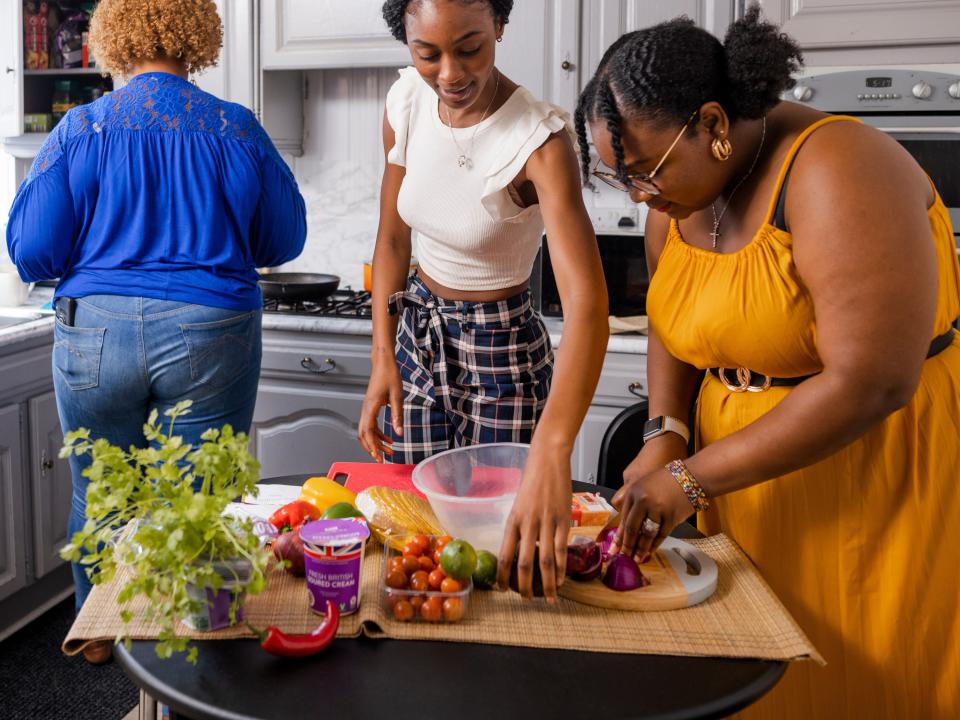 People cooking in a kitchen.