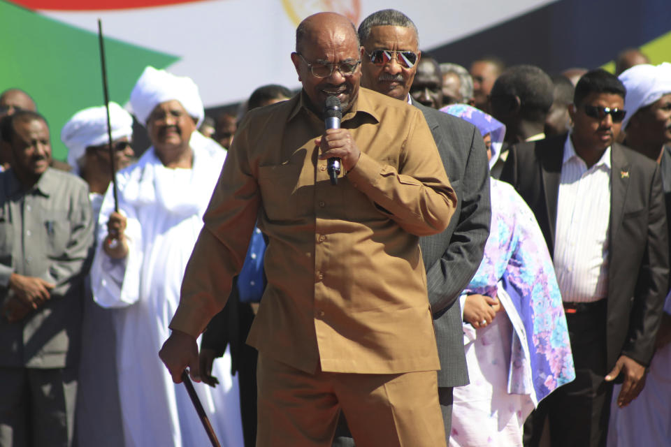 Sudan’s President Omar al-Bashir addresses supporters at a rally in Khartoum, Sudan, Wednesday, Jan. 9, 2019. Al-Bashir told the gathering of several thousands of supporters in the capital that he is ready to step down only “through election.” The remarks come after three weeks of anti-government protests. (AP Photo/Mahmoud Hjaj)