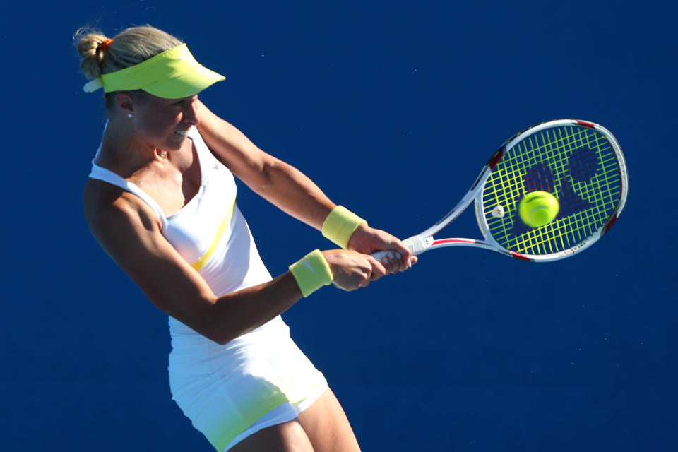 Andrea Hlavackova of the Czech Republic plays a backhand her first round doubles match with Lucie Hradecka of the Czech Republic against Eleni Daniilidou of Greece and Christina McHale of the United States during day three of the 2013 Australian Open at Melbourne Park on January 16, 2013 in Melbourne, Australia. 