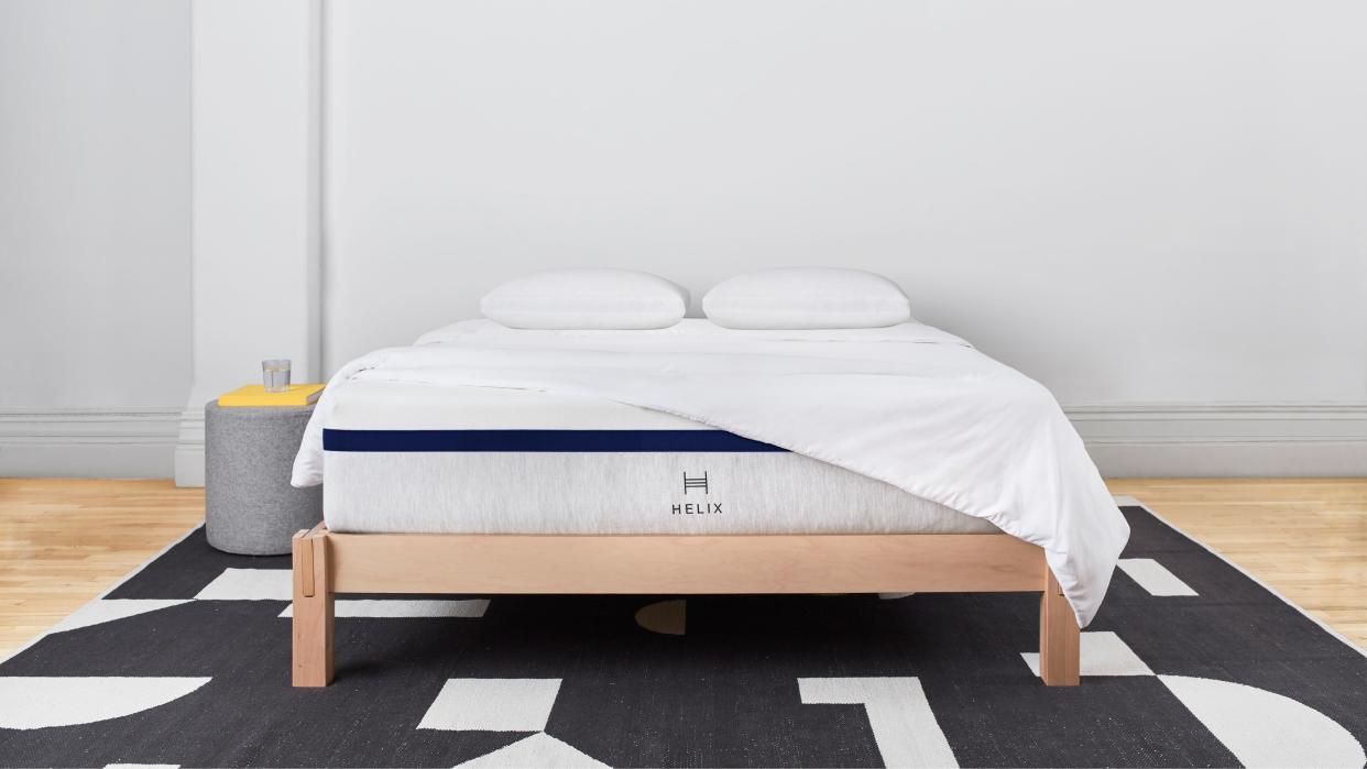  Helix mattress on wooden bedframe. 