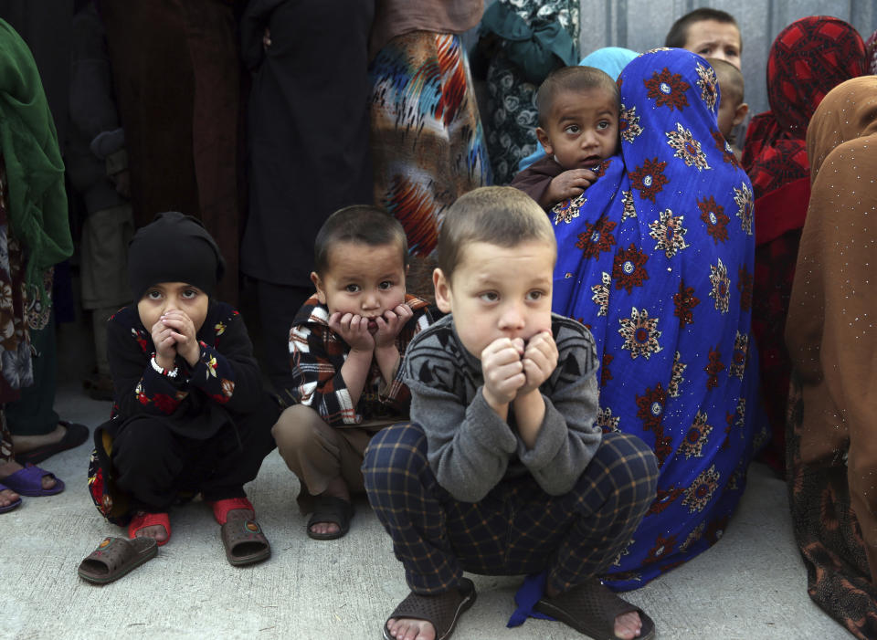 Family members of Islamic State militants either arrested or surrounded up to the Afghan government are presented to media in Kabul, Afghanistan, Saturday, Dec. 21, 2019. The country's intelligence service says Saturday that there are more than 75 women and 159 children most of them form foreign countries in the custody of the agency known as the National Deteriorate for Security. (AP Photo/Rahmat Gul)