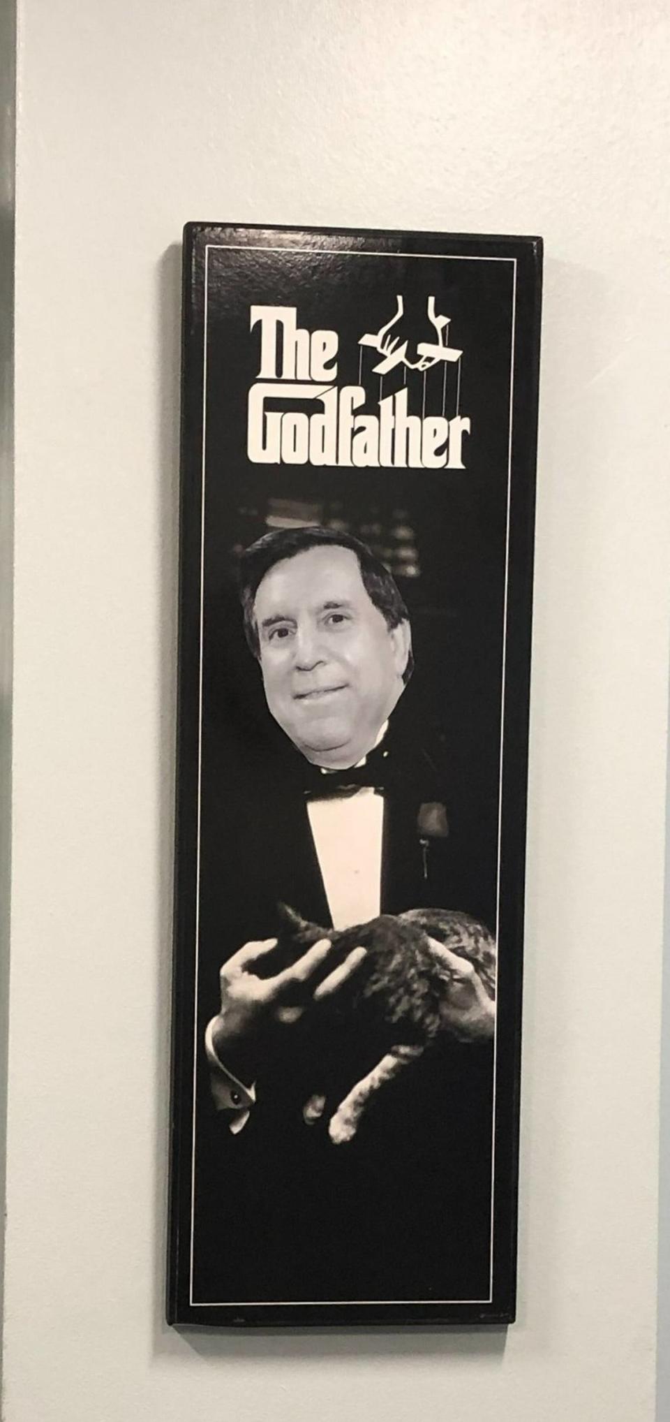 A framed photo of Miami Commissioner Joe Carollo with his face superimposed over the body of Vito Corleone, the titular character from the mobster film “The Godfather,” was spotted hanging in Carollo’s City Hall office.