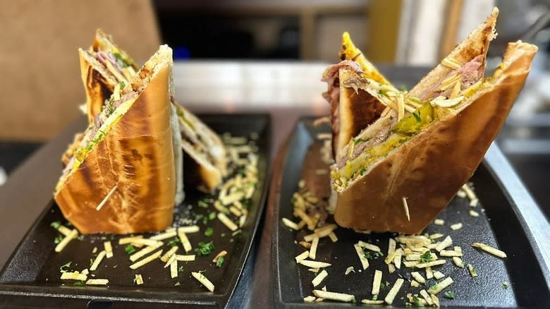 Cuban sandwiches on plates