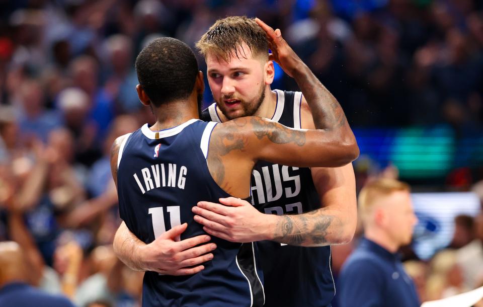 Luka Doncic celebrates with Kyrie Irving during the Mavericks' run to the Western Conference crown.