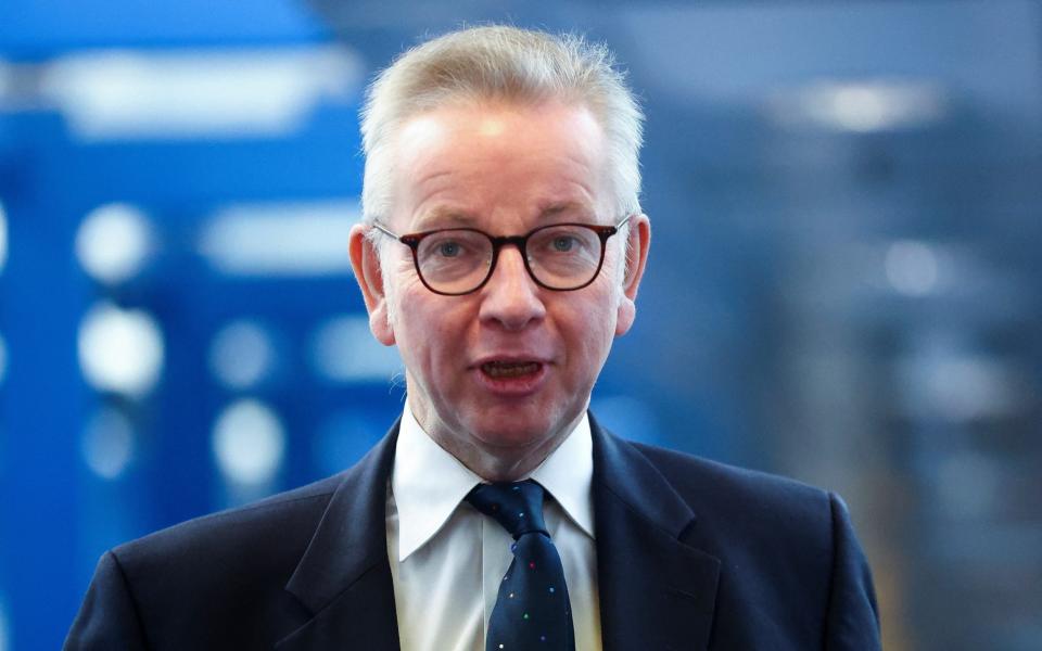 Michael Gove is pictured at Conservative Party conference in Birmingham this morning  - Hannah McKay /Reuters 