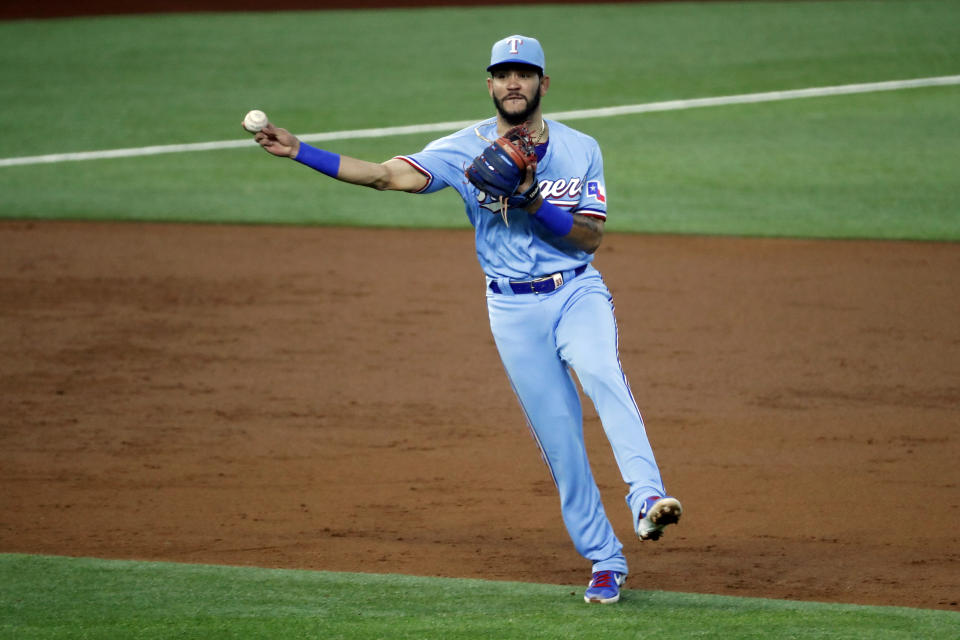 Texas Rangers shortstop Anderson Tejeda throws to first during the third inning of a baseball game against the Houston Astros in Arlington, Texas, Sunday, Sept. 27, 2020. (AP Photo/Roger Steinman)