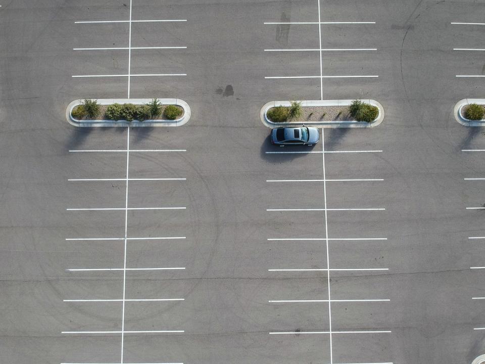 a car parked at a large parking lot
