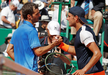 Tennis - Monte Carlo Masters - Monaco, 22/04/2017. Albert Ramos-Vinolas of Spain shakes hand with Lucas Pouille of France after their match. REUTERS/Eric Gaillard