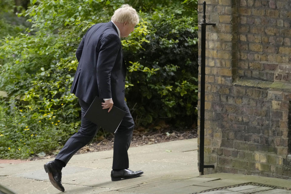 FILE - Britain's Prime Minister Bortis Johnson walks in Downing Street to a press conference in London, Wednesday, May 25, 2022. British media say Prime Minister Boris Johnson has agreed to resign on Thursday, July 7 2022, ending an unprecedented political crisis over his future. (AP Photo/Kirsty Wigglesworth, File)