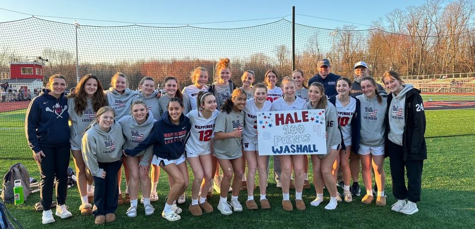 Wappingers girls lacrosse teammates pose while celebrating Haley Washall, a freshman who eclipsed 100 career points during a March 25, 2024 win over Clarkstown South.