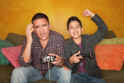 Father and son playing a video game