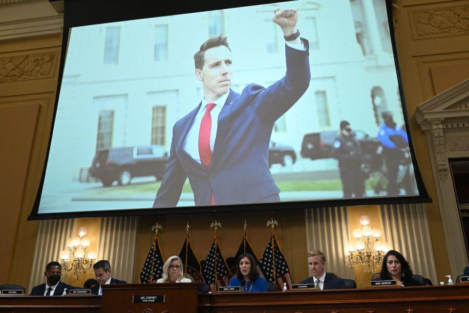An image of Sen. Josh Hawley, R-Mo., raising his fist to protesters outside the U.S. Capitol on Jan. 6, 2021, is displayed on July 21, 2022, during a hearing by the House Select Committee to investigate the Jan. 6 attack. <a href="https://www.gettyimages.com/detail/news-photo/an-image-of-us-senator-josh-hawley-raising-his-fist-to-news-photo/1242042110?phrase=hawley%20fist&adppopup=true" rel="nofollow noopener" target="_blank" data-ylk="slk:Saul Loeb/AFP via Getty Images;elm:context_link;itc:0;sec:content-canvas" class="link ">Saul Loeb/AFP via Getty Images</a>