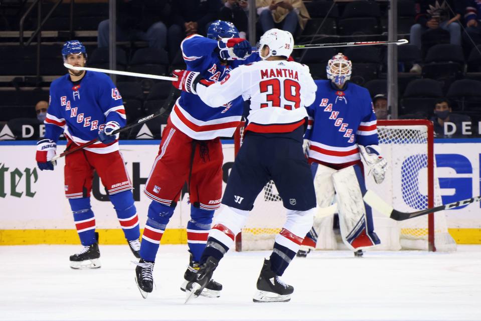 Pavel Buchnevich high-sticks Anthony Mantha in the face during the second period.