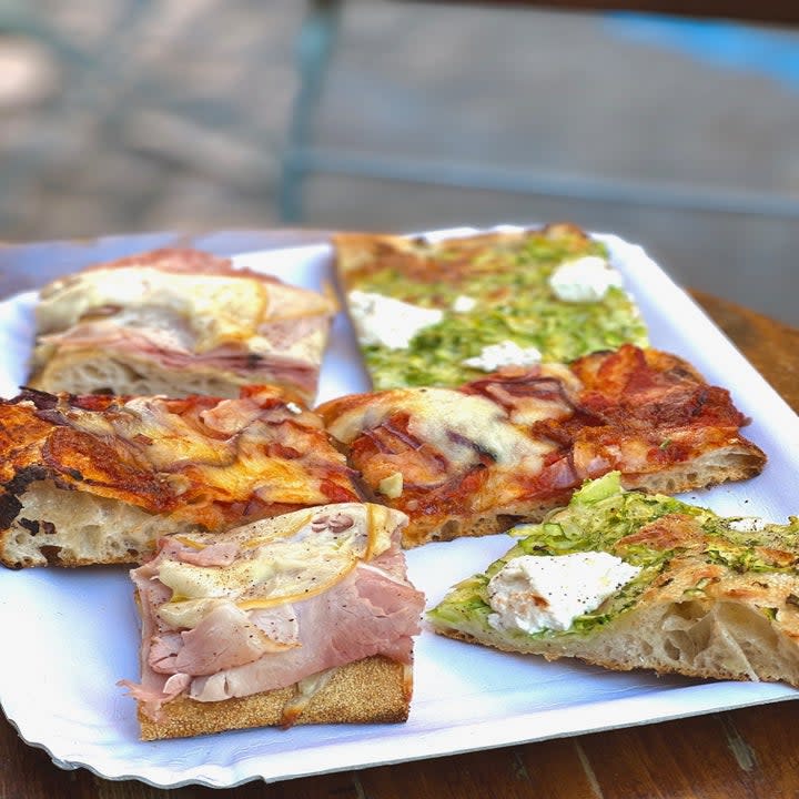 Slices of pizza with various toppings