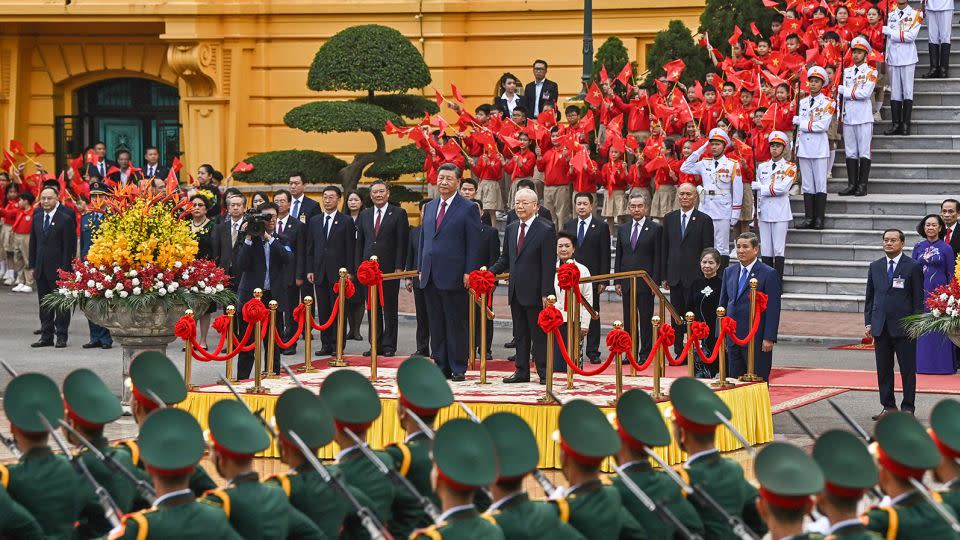 Chinese leader Xi Jinping and Vietnamese counterpart Nguyen Phu Trong during a welcome ceremony at the Presidential Palace in Hanoi on December 12, 2023. - Nhac Nguyen/AFP/Getty Images