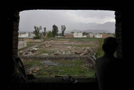 A labourer is seen working at a house in front of the demolished compound of slain Al-Qaeda leader Osama bin Laden, in northern Abbottabad. A year after bin Laden died in a US raid, Al-Qaeda keeps spreading its message of terror in Pakistan, analysts say, with splinter groups threatening the country's fragile stability