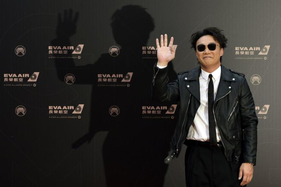 Hong Kong singer Eason Chan gestures upon his arrival for the 30th Golden Melody Awards in Taipei on June 29, 2019. (Photo by Sam YEH / AFP)        (Photo credit should read SAM YEH/AFP/Getty Images)