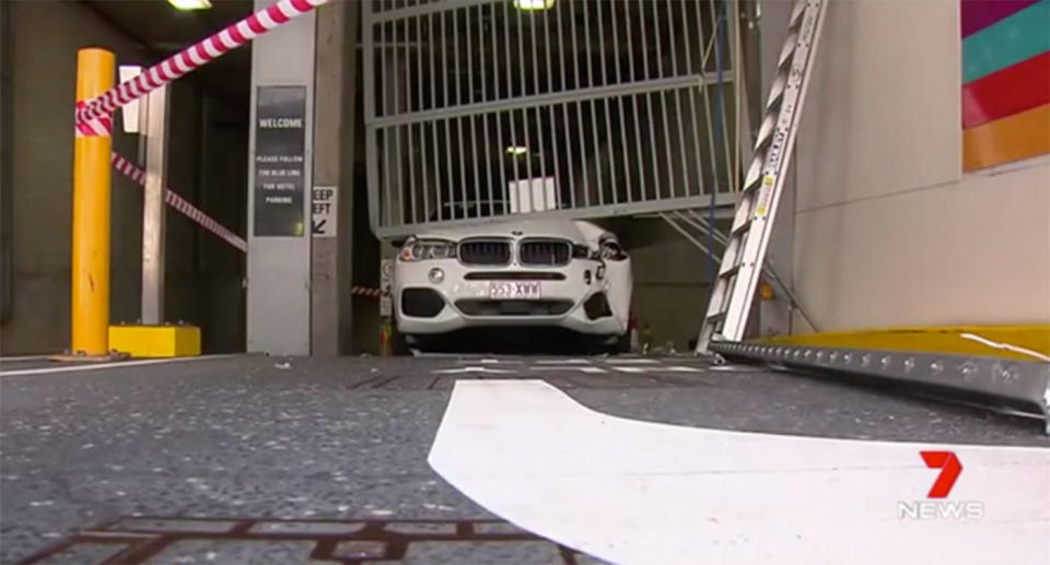 A heavy steel gate at the Hilton Hotel, Surfers Paradise, came crashing down on a BMW full of unwitting tourists. Source: 7 News