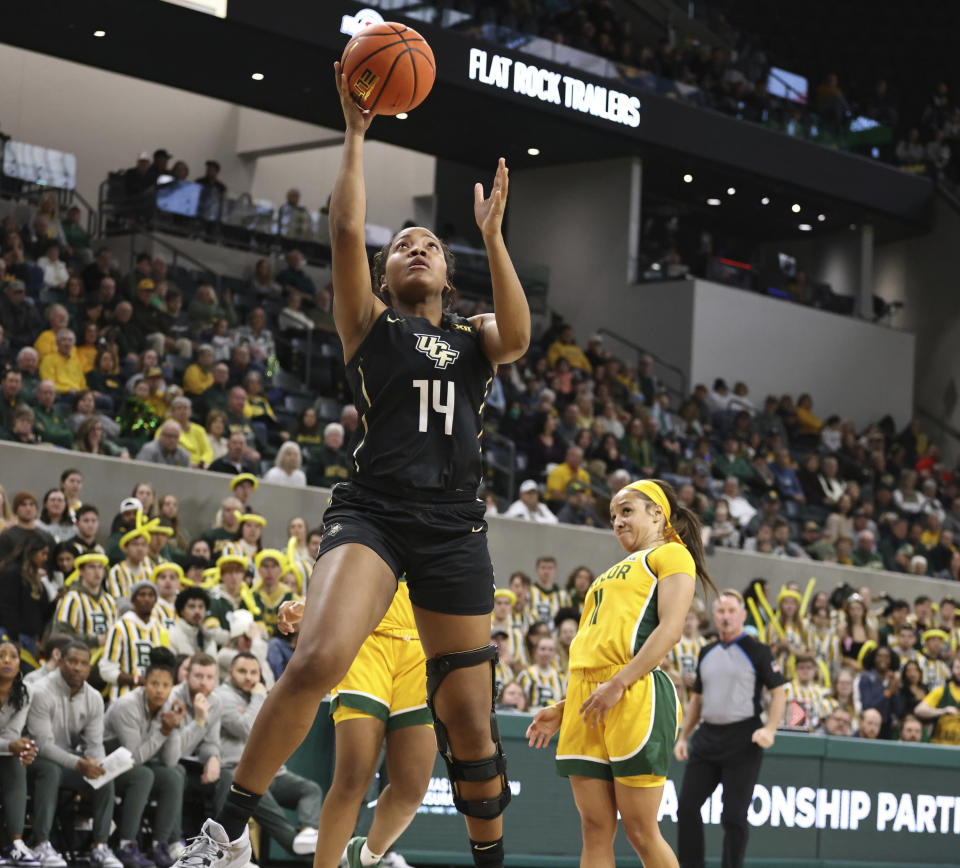 Central Florida guard Asia Todd scores past Baylor guard Jada Walker during the first half of an NCAA college basketball game, Saturday, Jan. 20, 2024, in Waco, Texas. (Rod Aydelotte/Waco Tribune-Herald via AP)