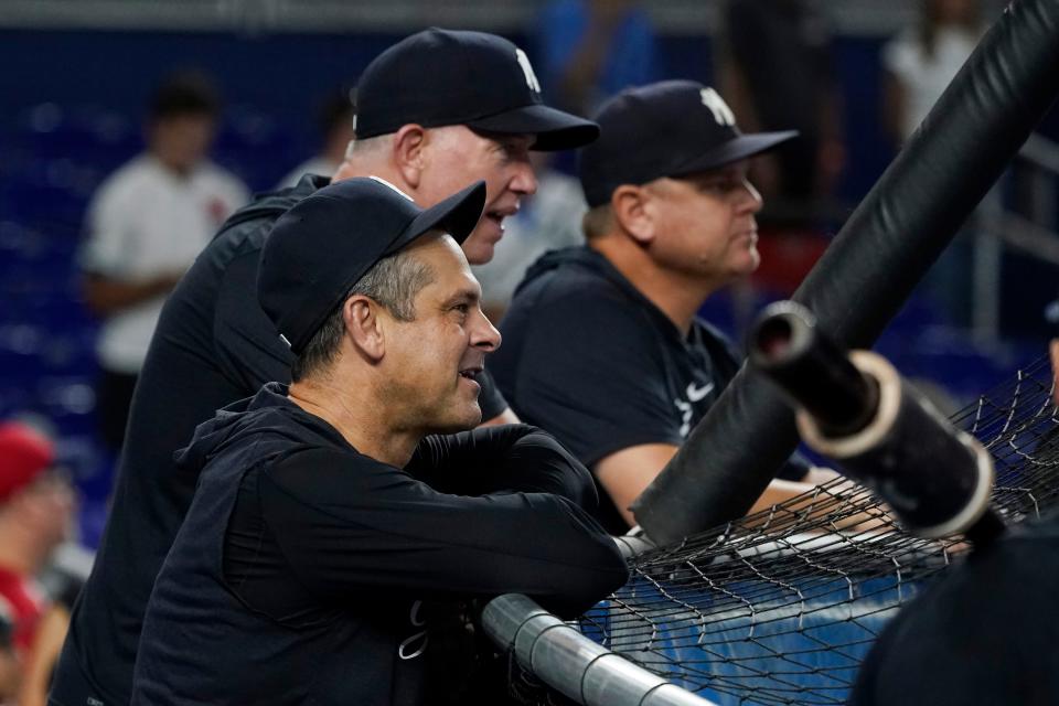 New York Yankees manager Aaron Boone watches batting practice before a baseball game against the Miami Marlins, Saturday, Aug. 12, 2023, in Miami. (AP Photo/Marta Lavandier)