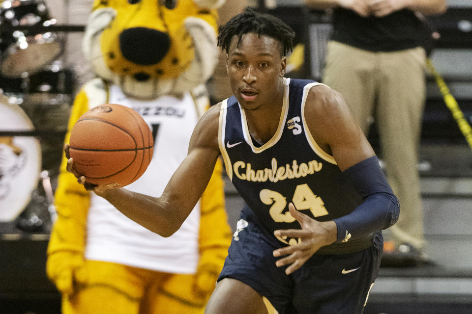 FILE - Charleston Southern's Phlandrous Fleming Jr. brings the ball up court during the first half of an NCAA college basketball game against Missouri in Columbia, Mo., in this Tuesday, Dec. 3, 2019, file photo. Florida added three defensive stalwarts via the NCAA transfer portal, led by two-time Big South defensive player of the year Phlandrous Fleming and Summit League defensive player of the year Brandon McKissic, to bolster a lineup the Gators believe will be able to compete in the stacked Southeastern Conference. (AP Photo/L.G. Patterson, File)