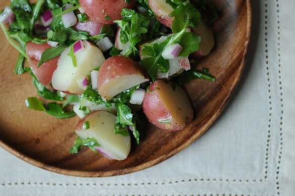 <div class="caption-credit"> Photo by: Food52</div><div class="caption-title">Potato Salad with Arugula and Dijon Vinaigrette</div><i><b><a rel="nofollow noopener" href="http://food52.com/recipes/12198-potato-salad-with-arugula-and-dijon-vinaigrette" target="_blank" data-ylk="slk:Get the recipe on Food52;elm:context_link;itc:0;sec:content-canvas" class="link ">Get the recipe on Food52</a></b>. <br></i> <br> The fresh, bold flavors in the salad are the reason for its success, and grilling the potatoes can distract from this. But by all means use the grill if you'd like -- just blanch the potatoes first, and then finish them on skewers on the grill for a few minutes. - merrill