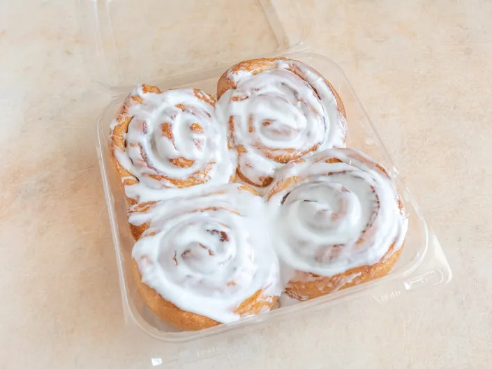 cinnamon rolls in a plastic container