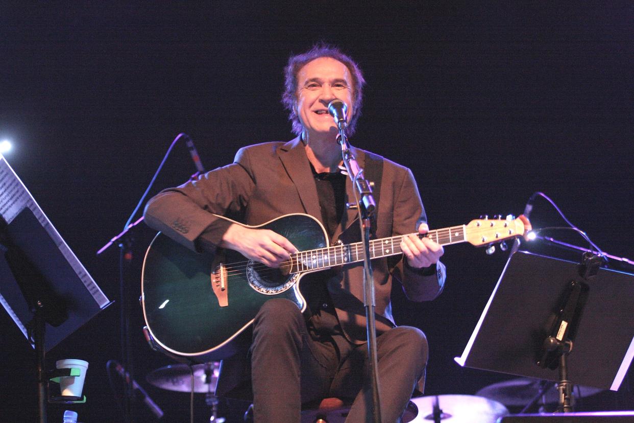 Singer, songwriter and guitarist Ray Davies is shown performing on stage during a 