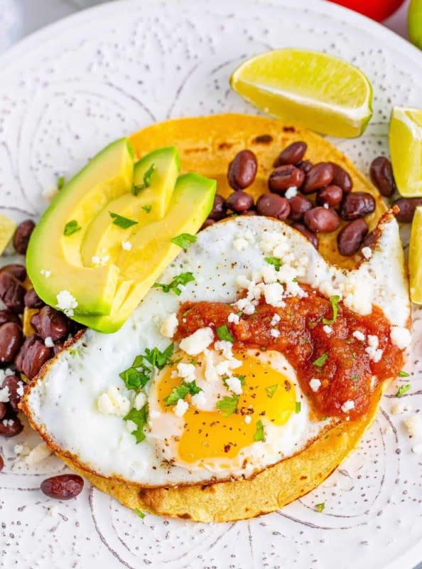 <p>The Country Cook</p><p>A traditional Mexican breakfast, brunch or "brinner" with not a lot of ingredients that are easy to put together. </p><p><strong>Cost: $12.40</strong> (including the eggs)</p><p><strong>Get the recipe: <a href="https://www.thecountrycook.net/huevos-rancheros/" rel="nofollow noopener" target="_blank" data-ylk="slk:Huevos Rancheros;elm:context_link;itc:0;sec:content-canvas" class="link rapid-noclick-resp">Huevos Rancheros</a></strong></p>