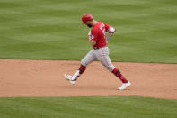 Cincinnati Reds' Jesse Winker celebrates as he rounds the bases after hitting a solo home run during the ninth inning of a baseball game against the St. Louis Cardinals Sunday, June 6, 2021, in St. Louis. (AP Photo/Jeff Roberson)