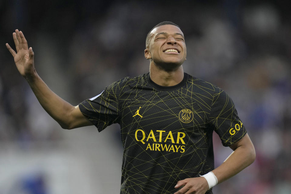 PSG's Kylian Mbappe celebrates after scoring during the French League One soccer match between Auxerre and Paris Saint Germain, at the Abbe Deschamps stadium in Auxerre, central France, Sunday, May 21, 2023. (AP Photo/Thibault Camus)