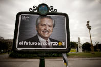FILE - In this Aug. 7, 2019 file photo, a billboard advertises pre-presidential candidate Alberto Fernandez, representing the "Frente de Todos" political party, in Buenos Aires, Argentina. Farmers are bracing for a possible return of the interventionist policies of Maurico Macri’s main - and now favored - rival: the presidential ticket of Alberto Fernández and former president Cristina Fernández. (AP Photo/Natacha Pisarenko, File)